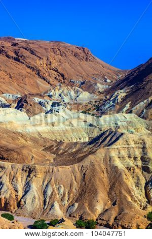 Picturesque multi-colored taluses dry sandstone. Ancient mountains in the valley of the Dead Sea