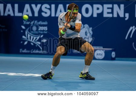 KUALA LUMPUR, MALAYSIA - OCTOBER 01, 2015: David Ferrer of Spain hits a backhand return in his match at the Malaysian Open 2015 Tennis tournament held at the Putra Stadium, Malaysia. 