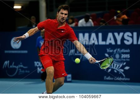 KUALA LUMPUR, MALAYSIA - OCTOBER 01, 2015: Mischa Zverev of Germany attempts a forehand return during his match at the Malaysian Open 2015 Tennis tournament held at the Putra Stadium, Malaysia.