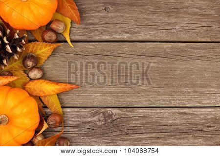 Autumn side border against rustic wood