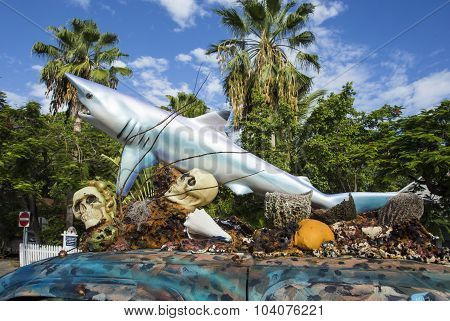 Car With A Sculpture Of A Shark And Skull And Plastic Shells On The Roof