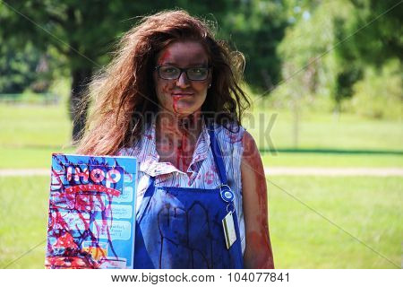 MUSKOGEE, OK - Sept. 12: An actor dressed as a zombie hides in a field and waits for the next runner during the Castle Zombie Run at the Castle of Muskogee in Muskogee, OK on September 12, 2015. 
