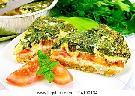 Pie celtic with spinach in plate on board