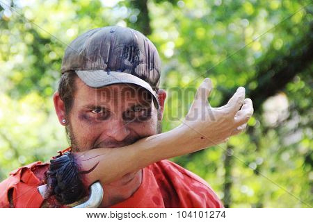 MUSKOGEE, OK - Sept. 12: A man dressed as a zombie waits for runners during the Castle Zombie Run at the Castle of Muskogee in Muskogee, OK on September 12, 2015.