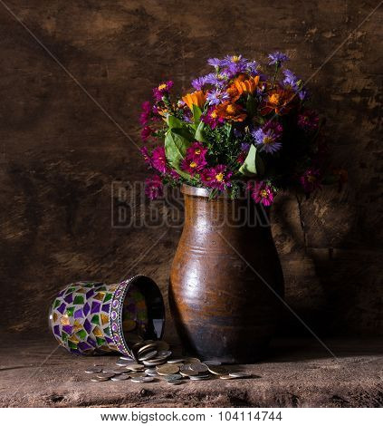 Flowers In Vase And Pile Of Old Coins