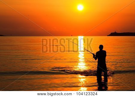 Fisherman Silhouette At Sunrise