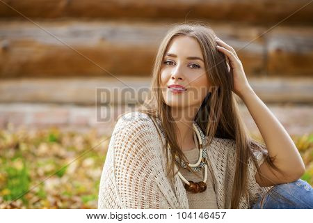 Portrait close up of young beautiful blonde women, on golden background autumn nature
