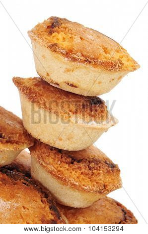 closeup of some pasteis de feijao typical Portuguese pastries, on a white background