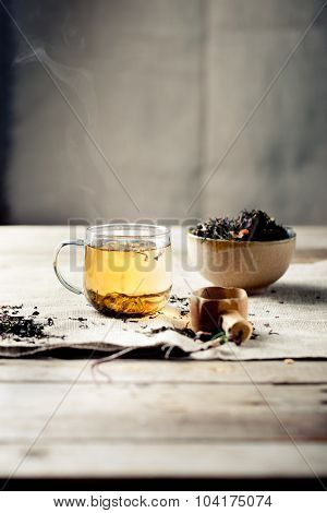 Green tea in a glass cup with steam