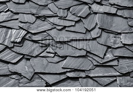 Rustic background of decorative black schist blades