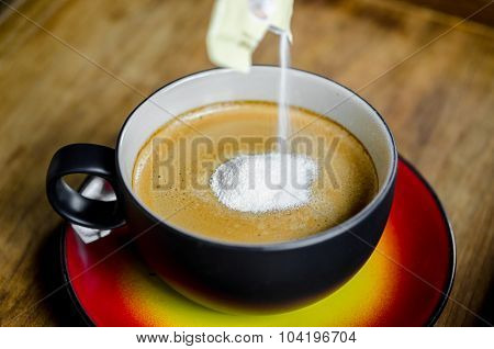 Creamer In To A Cup Of Coffee.