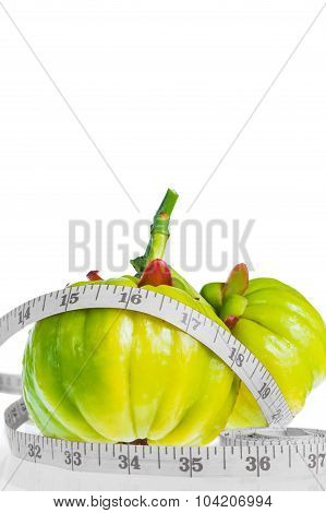Garcinia Cambogia With Measuring Tape, Isolated On White Background.