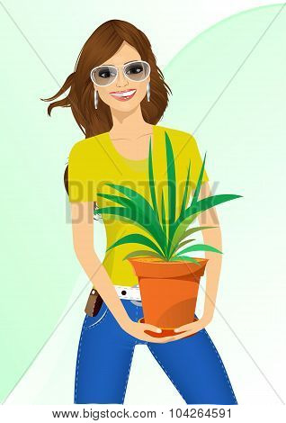 smiling woman holding chlorophytum