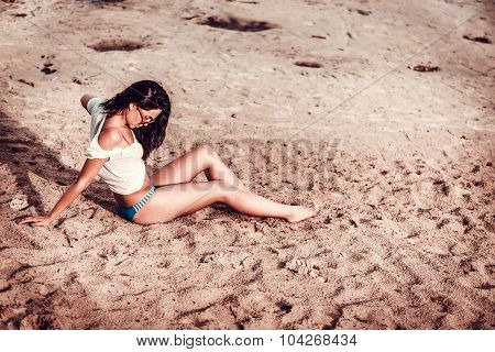 Long Hair Girl Relaxing On The Beach