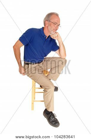 Old Man Sitting On Chair Thinking.