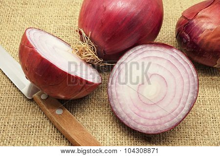 Whole And Sliced Red Onions