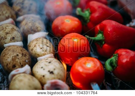 Veggies on barbeque tomatoes, red bell pepper, potatoes