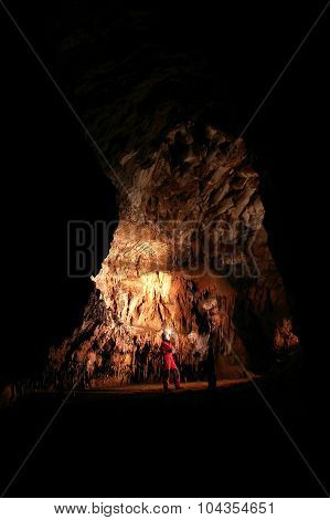 Spelunker Wondering In A Cave