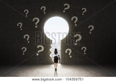 A Keyhole In The Concrete Wall. A Business Lady Dressed In Formal Suit Is Looking At New York City I