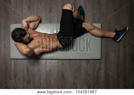 Healthy Man Doing Abdominal Excerise On Foor