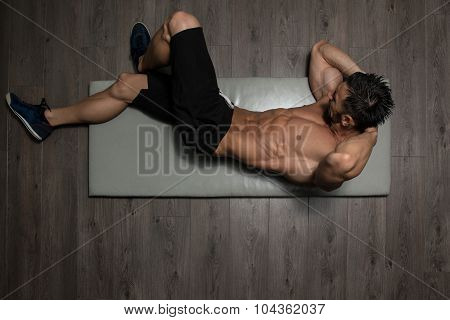 Healthy Man Doing Sit-ups On Foor