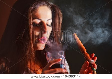 beautiful girl in smoke with hookah