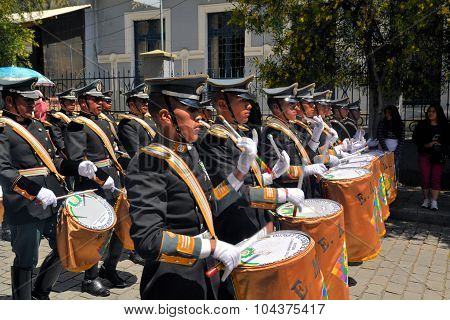 La Paz, Bolivia - 23 March 2013: Musicians march in military parade for dia del mar in La Paz capitol Bolivia. Die del Mar is celebrated annually on the day Bolivia lost the Litoral province to Chile and therefore sea access in the war of the pacific.