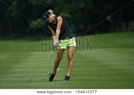 KUALA LUMPUR, MALAYSIA - OCTOBER 09, 2015: England's Melissa Reid plays from 6th hole fairway of the Kuala Lumpur Golf & Country Club at the 2015 Sime Darby LPGA Malaysia golf tournament.