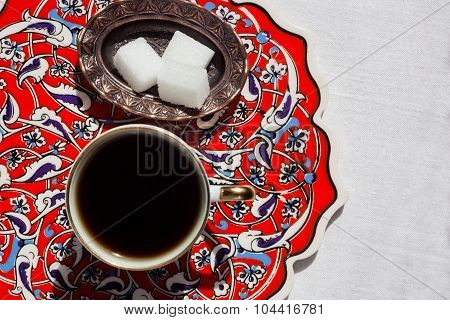 Patterns on the ceramic table with coffee cup