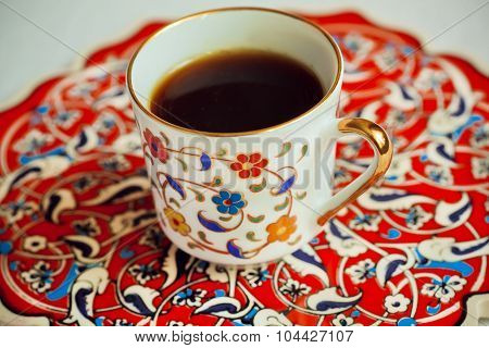 Cup of coffee on the lovely traditional-style tray painted