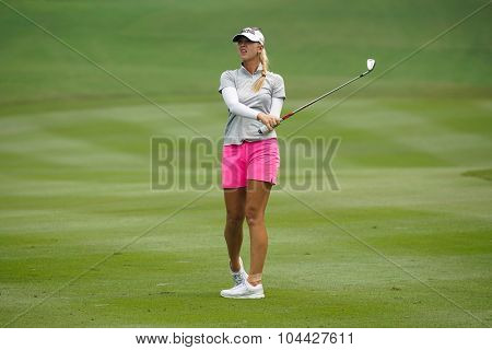 KUALA LUMPUR, MALAYSIA - OCTOBER 10, 2015: USA's Jessica Korda hits to the green of the 18th hole of the KL Golf & Country Club during the 2015 Sime Darby LPGA Malaysia golf tournament.