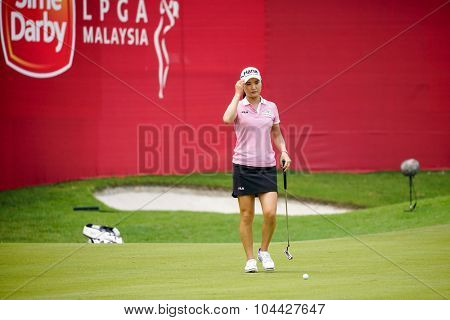 KUALA LUMPUR, MALAYSIA - OCTOBER 10, 2015: South Korea's So Yeon Ryu checks the green of the 18th hole of the KL Golf & Country Club during the 2015 Sime Darby LPGA Malaysia golf tournament.
