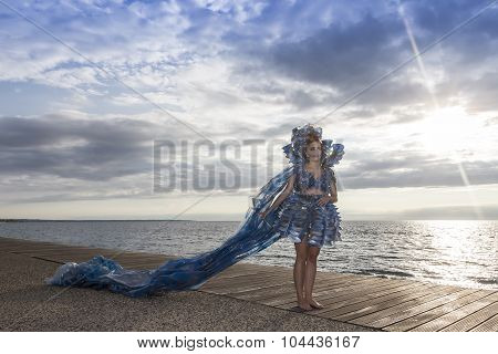 Models Walk An During  Outdoor Fashion Show With Clothing Made Out Of Recycled Materials Was Held In