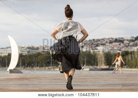 Models Walk An During  Outdoor Fashion Show With Clothing Made Out Of Recycled Materials Was Held In