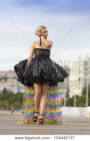 Models Walk An During  Outdoor Fashion Show With Clothing Made Out Of Recycled Materials Was Held In
