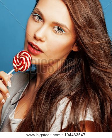 young pretty adorable woman with candy close up like doll