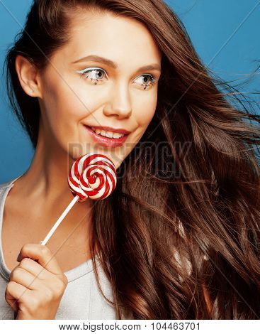 young pretty adorable woman with candy close up like doll
