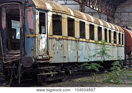 Abandoned train carriage in a decaying depo