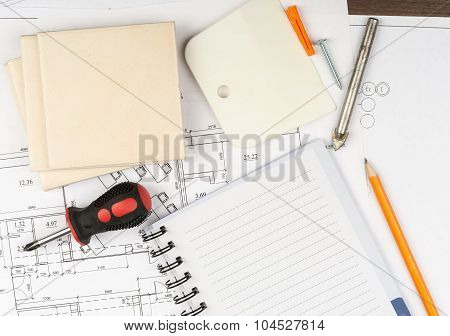 Copy book with tiles and screwdriver