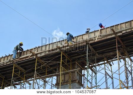 Group of construction worker fabricating beam formwork