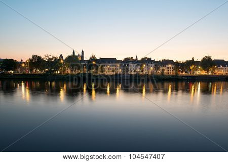 Maastricht across the river during sunset