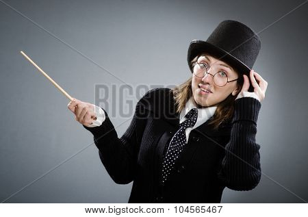  Potter girl with magic stick against gray
