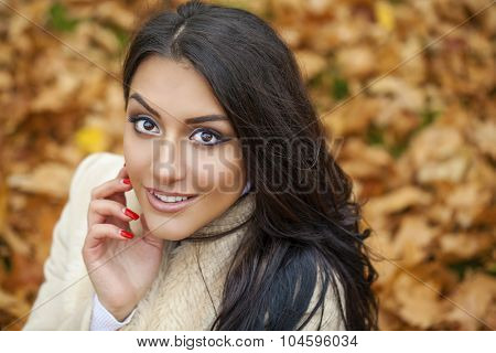 Facial portrait of a beautiful arab woman warmly clothed autumn outdoor
