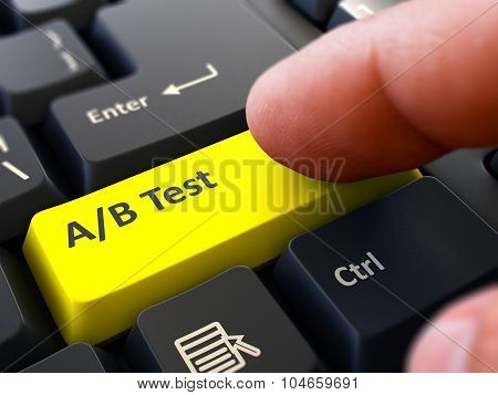 AB Test - Concept on Yellow Keyboard Button.