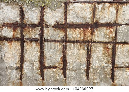 Fragment Of A Concrete Wall With A Rusty Wire Mesh