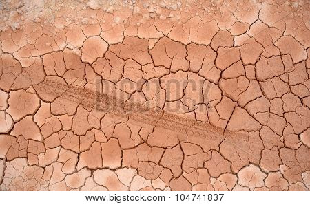 Tire Tracks Prints In Cracked Dry Soil