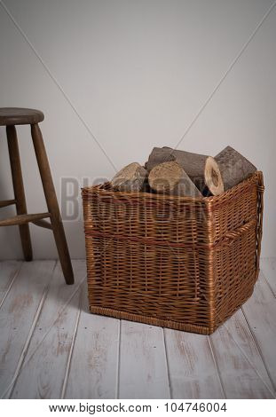 Logs In Wicker Basket