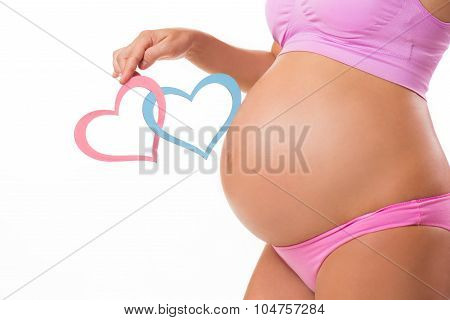 Close-up Of A Pregnant Belly With Pink And Blue Hearts. Guess The Baby-child: Girl, Boy O