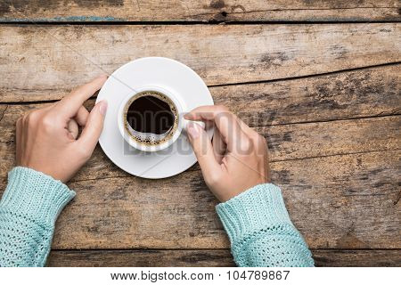 Woman's Hands Hold A Cup Of Strong Coffee.