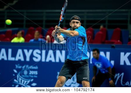 KUALA LUMPUR, MALAYSIA - OCTOBER 02, 2015: Benjamin Becker of Germany hits a backhand return in his match at the Malaysian Open 2015 tennis tournament held at the Putra Stadium, Malaysia.